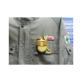 Image of safety alarm (product) installation on work uniform.