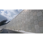 テールアルメは、フランスで1963年に開発された、鋼材を使用して土を補強し、垂直盛土を構築する工法です。
高い垂直盛土が構築可能な為、土地の有効利用が実現できます。日本では、導入以来様々な改善改良が加えられ一般工法として定着しております。
その50年の実績は、約1300万m2になります。（※2024年時点）