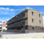 The deep bass of music heard from apartments and condominiums.