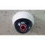 Dome-shaped security dummy camera with automatic LED lighting.