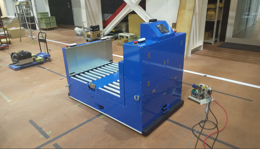 【AGV導入事例】製品搬送システム（ラップ包装前ダンボール搬送）