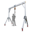 Portable gantry crane suitable for transporting heavy loads in a space-saving manner.
