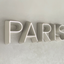 Beautiful and delicate resin LED sign of the Paris letters.
